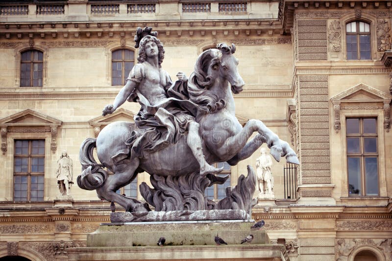 Statue of king Louis at Louvre Museum, Paris