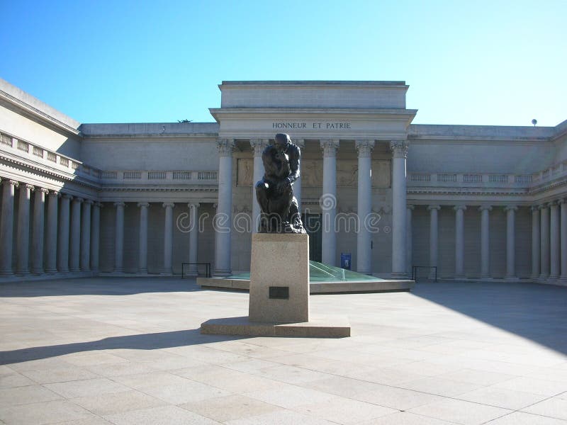 Classic stone statue in the middle of building.
