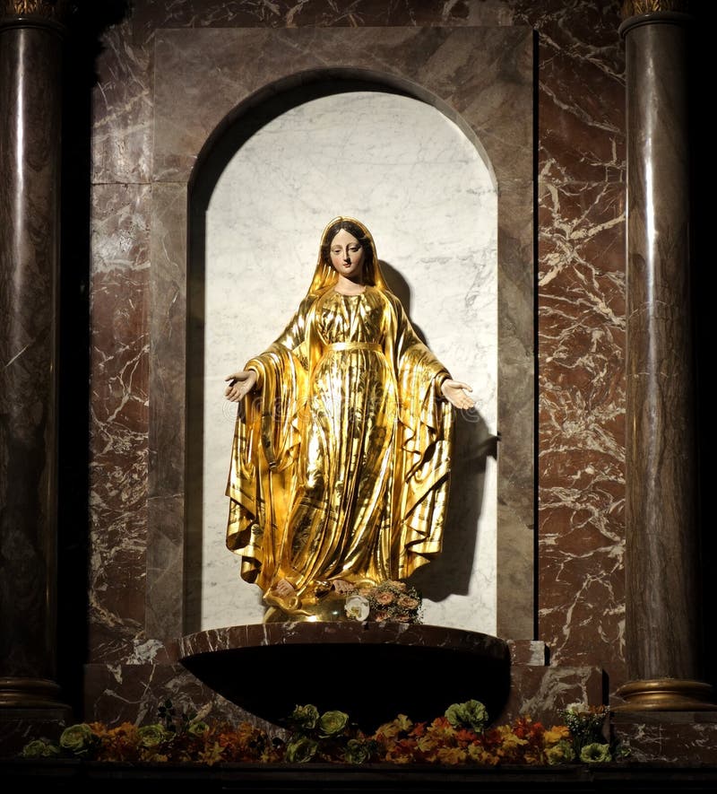 Statue of Mother Mary in Gold Gown Stock Image - Image of craft, layers ...