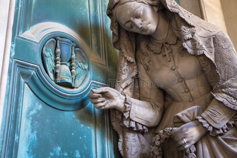 Statue on an old tomb - beginning of 1800, marble - located in Genoa cemetery, Italy