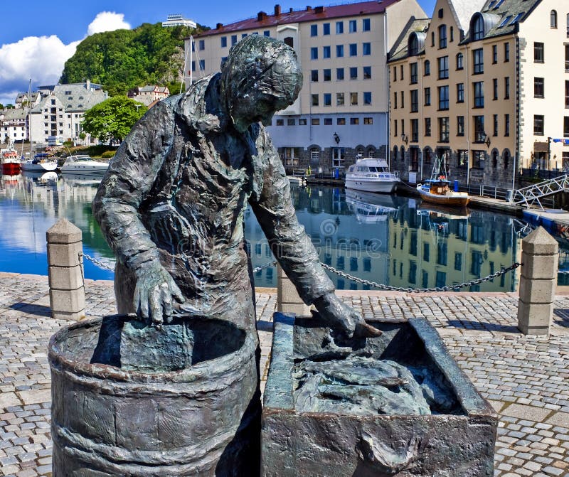 Statue of seasonal fish-worker in Alesund, Norway