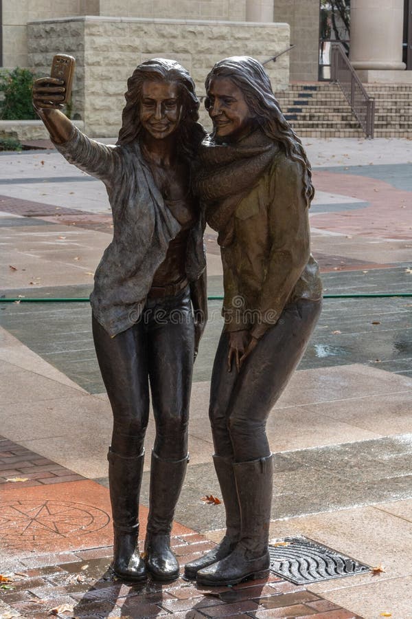 Statue of two girls posing for a selfie photo in Sugar Land, TX