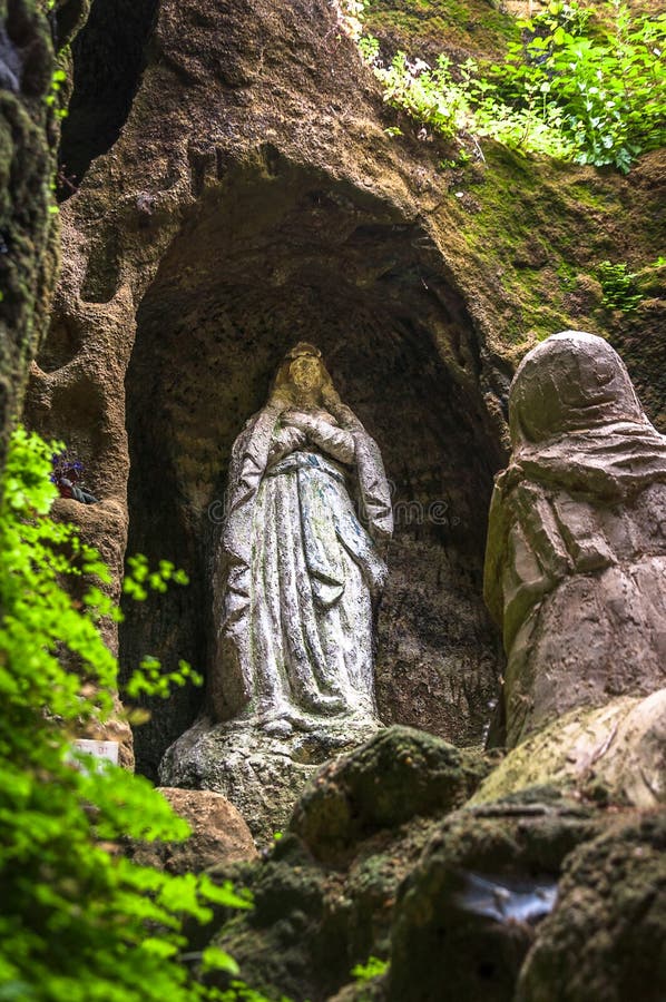 Statue Of The Virgin Mary In A Cave Stock Photo - Image of peaceful ...