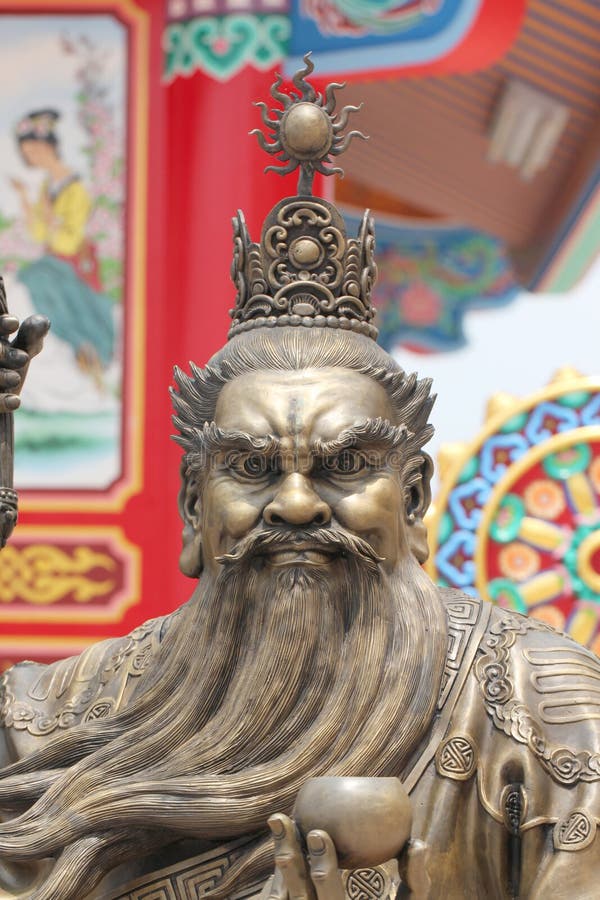 Statues of Chinese Deity and Lion Sculpture. Stock Photo Image of
