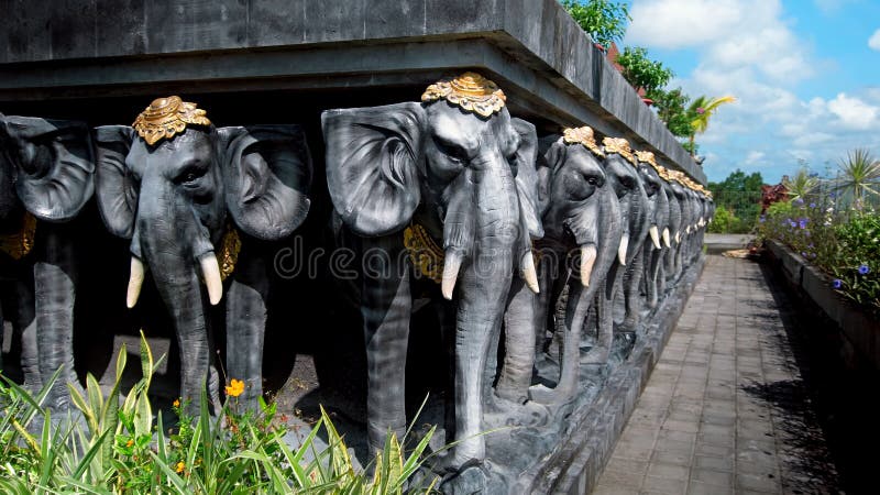 Statues of Elephants in Hats Holding a Concrete Slab Stock Photo ...