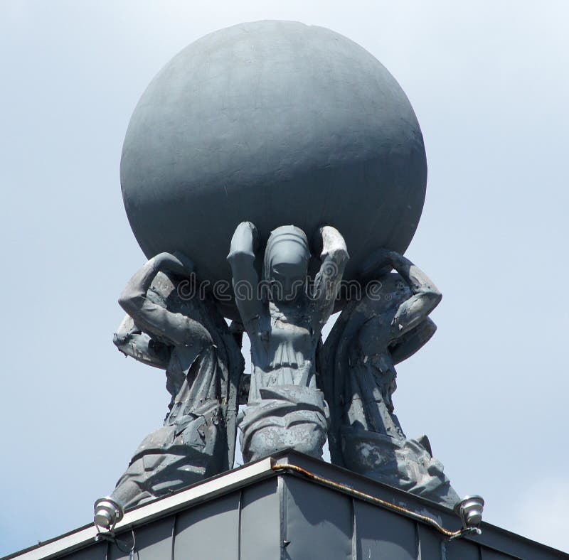Statues holding a globe stock photo. Image of kiev, round 54511708