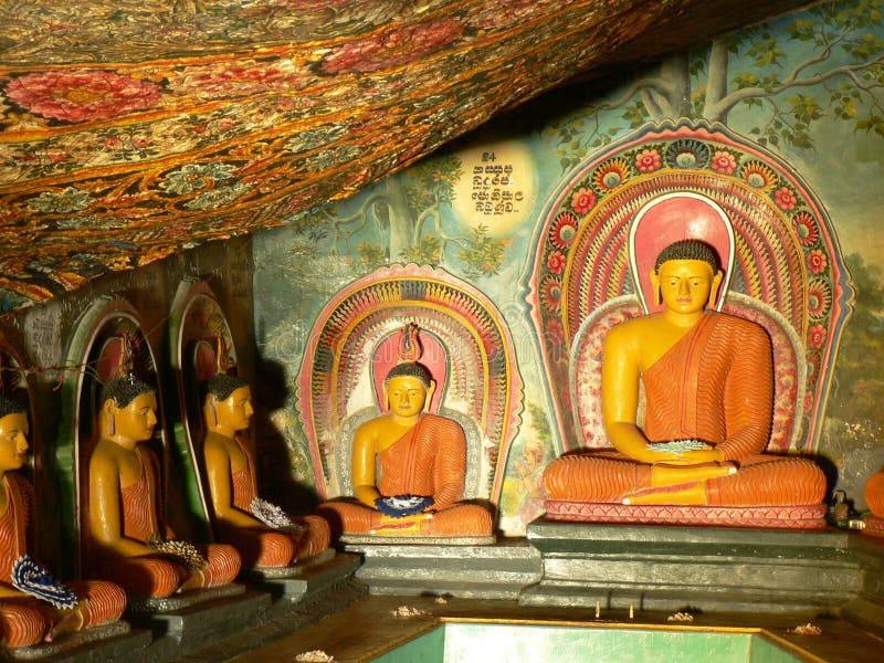 Statues of Lord Buddha & paintings of a buddhist temple royalty free stock images
