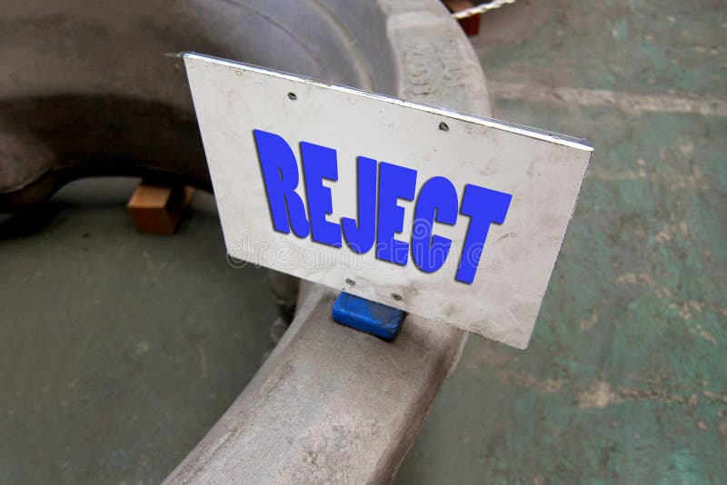 Reject (Bad product) status label magnet on the workpiece in the factory for identify