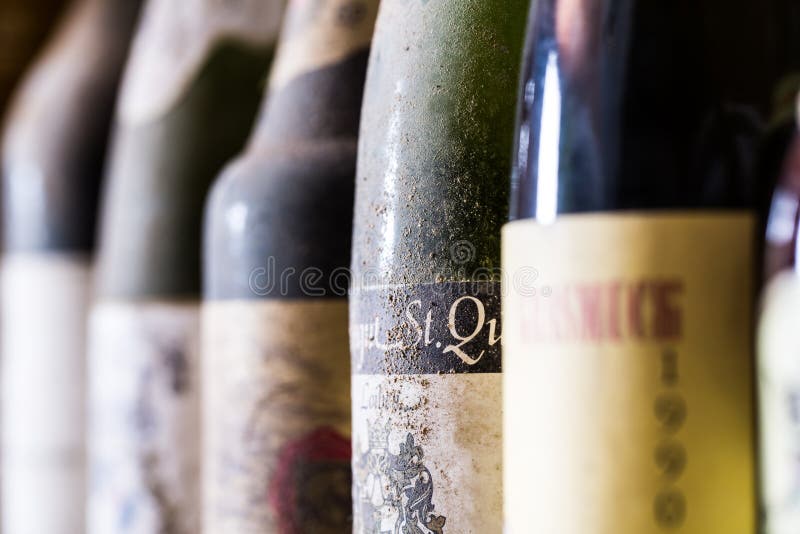 Dusty wine bottles on by one royalty free stock images Dusty wine bottles on by one royalty free stock images