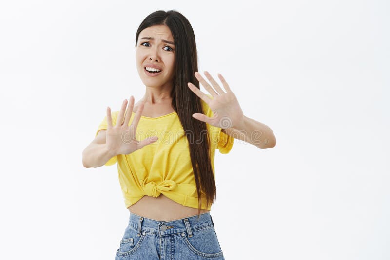 Stay Away From Me Portrait Of Woman In Panic Raising Hands Near Body In Defense Bending