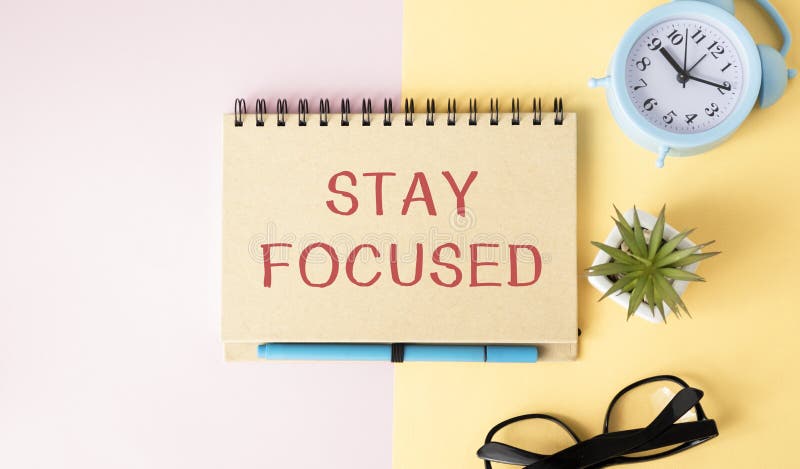 STAY FOCUSED man hand notebook and other office equipment such as computer royalty free stock images