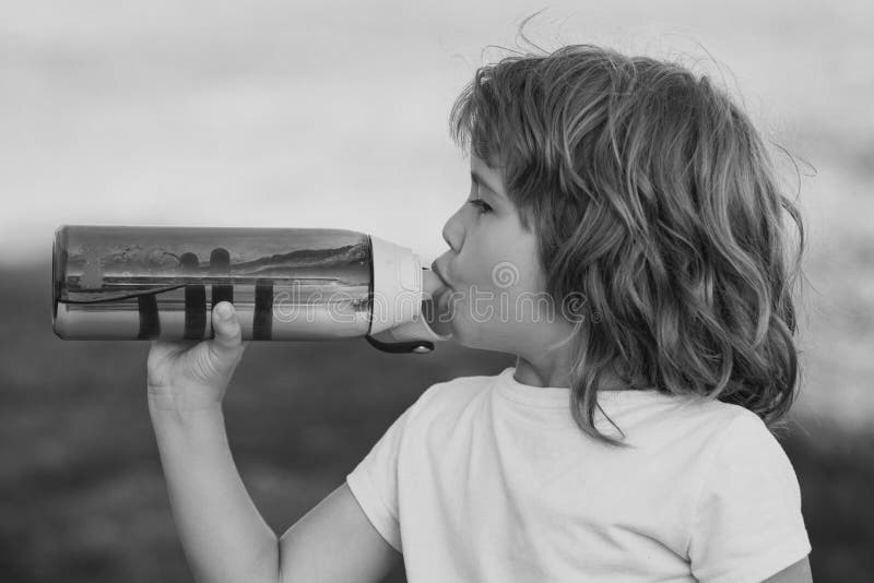 Stay Hydrated. Child with Bottle of Water. Stock Photo Image of drink