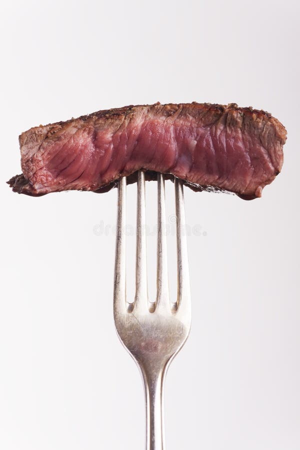 Steak on a fork stock photo. Image of background, brown - 12492200