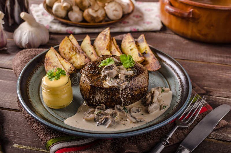 Steak with pepper sauce and mushrooms