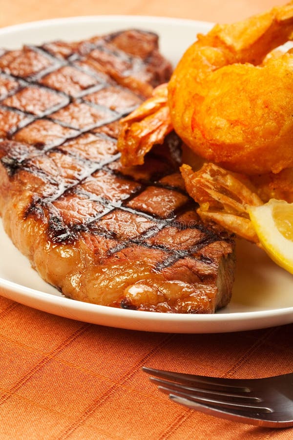 Steak and Shrimp stock photo. Image of lemon, fork, strip 18771812