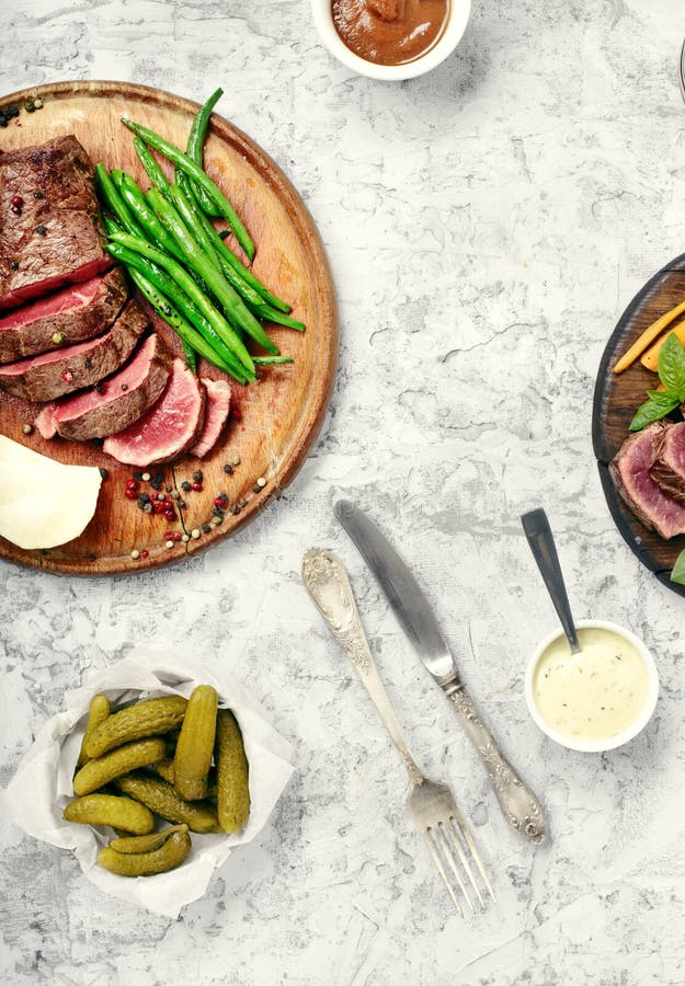 Steak with Vegetable Side Dish and Sauces Stock Photo Image of