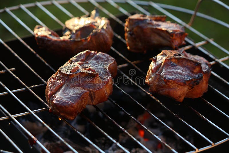Steaks on the grill stock photo. Image of bone, barbie 42877948