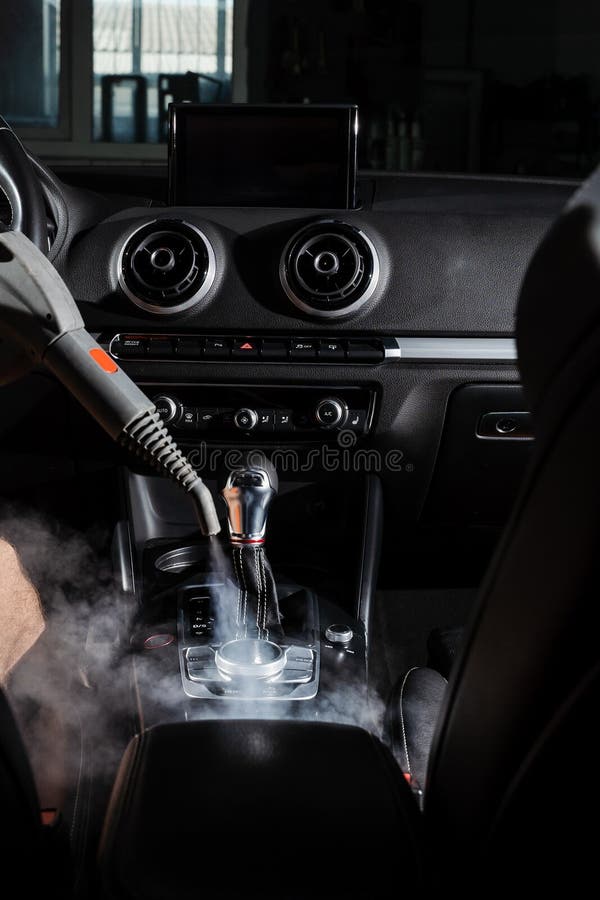 Steam Cleaning of Gearbox and Dashboard in Car. Vaping Steam Stock
