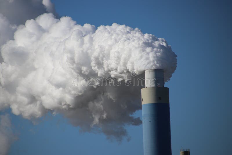 Steam coming out of the chimney at power plant in Rotterdam Maasvlakte in Netherlands royalty free stock images Steam coming out of the chimney at power plant in Rotterdam Maasvlakte in Netherlands royalty free stock images