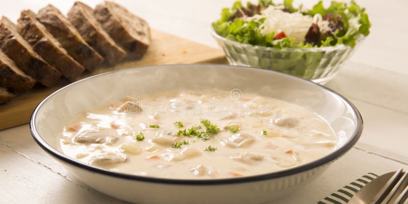 Steam rises from warm clam chowder on white background. Warm steam stock images, royalty-free photos and pictures