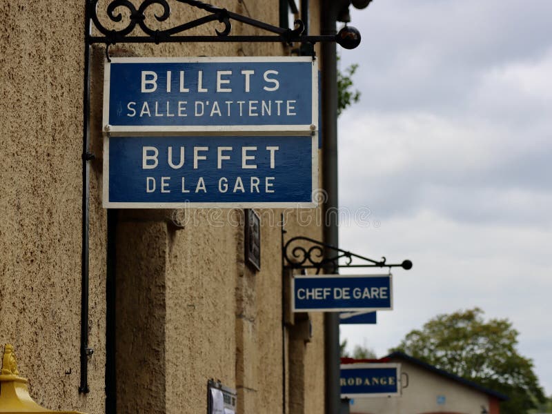 Historic steam train station in Fond-de-Gras, Luxembourg. French signs say &#x27;Tickets, waiting hall&#x27;, &#x27;Station bufet&#x27;, &#x27;Station head&#x27;, and showing direction to Rodange trains