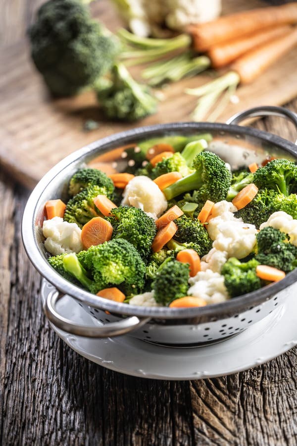 Steamed Broccoli, Carrots and Cauliflower in a Stainless Steel Steamer ...