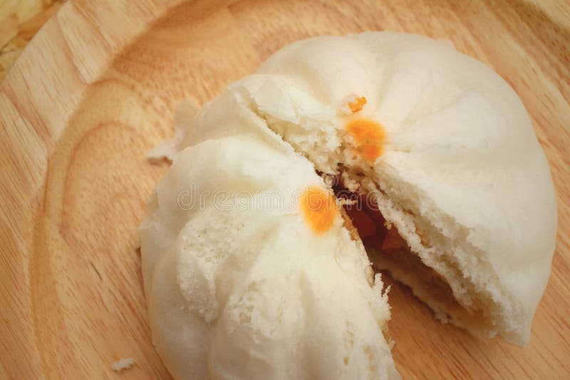 Steamed Dumpling Chinese Bun on Brown Background. Stock Photo Image
