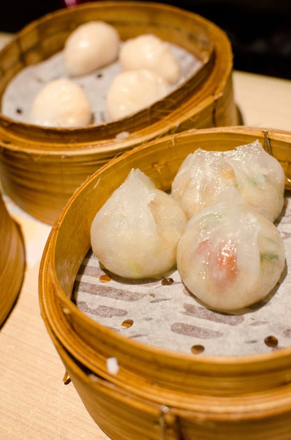 Steamed dumplings with shrimp and pork , Chinese style food also know as Dim Sum. Steamed dumplings with shrimp and pork , Chinese style food also know as Dim Sum