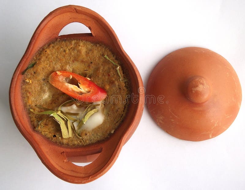 Steamed fish with curry paste in clay pot