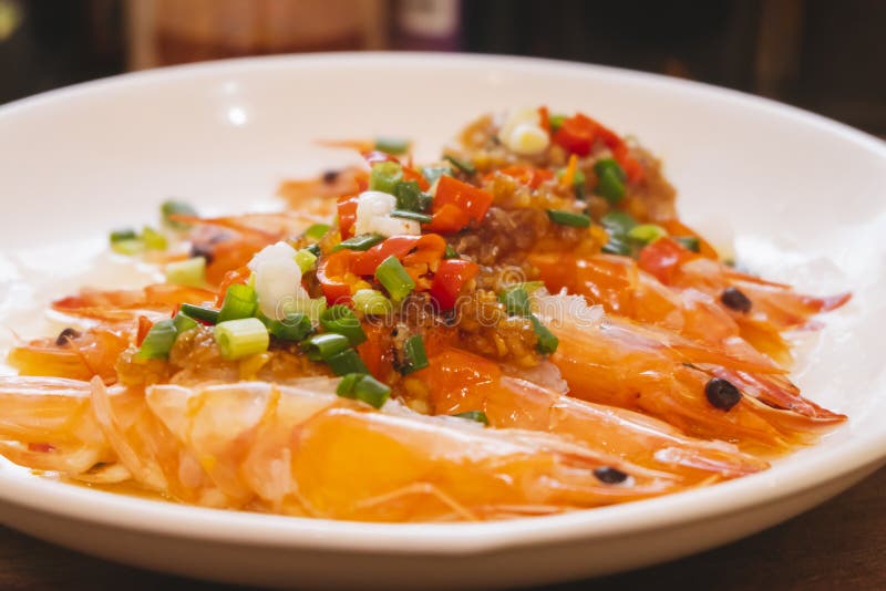 Close-up of steamed shrimp with minced garlic