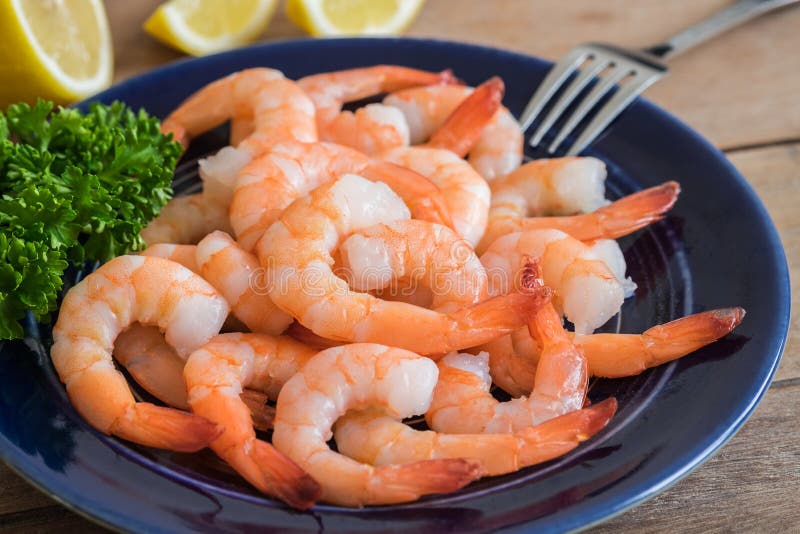 Steamed shrimp on blue plate. Steamed shrimp on blue plate