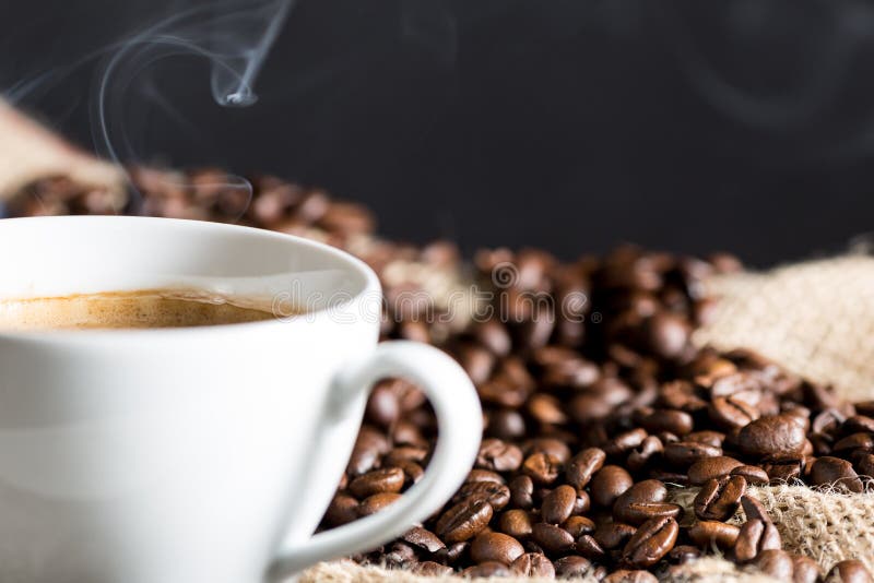 Cup of Coffee Surrounded by Coffee Beans. Top View Stock Photo Image