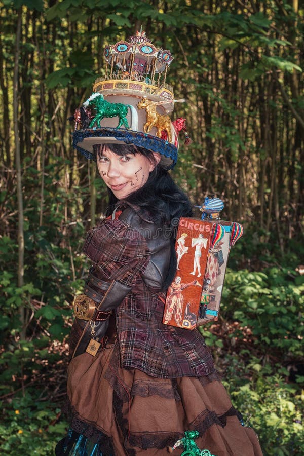 Steampunk girl decorated with circus and fun fair attributes during the Elf Fantasy Fair stock photos Steampunk girl decorated with circus and fun fair attributes during the Elf Fantasy Fair stock photos