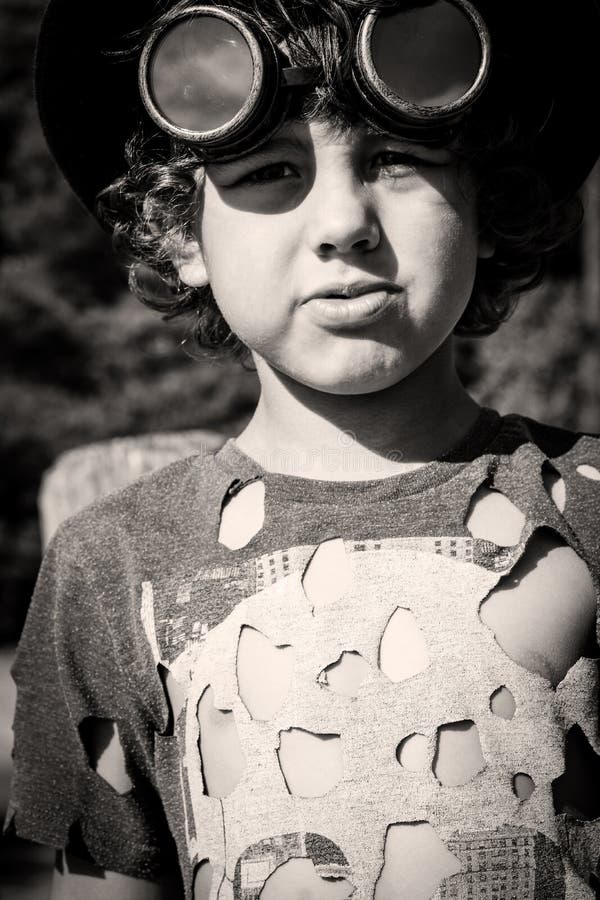 Steampunk kid playing on the bridge, in hat google ant t-hshirt. Perspective ant stock images, royalty-free photos and pictures