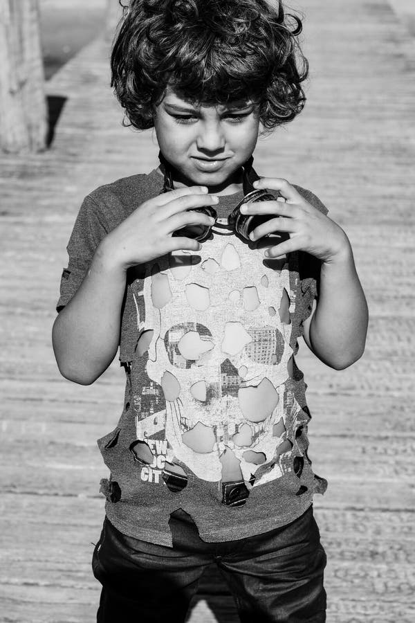 Steampunk kid playing on the bridge, in hat google ant t-hshirt. Perspective ant stock images, royalty-free photos and pictures