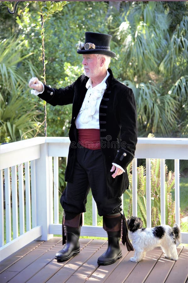 A steampunk pirate is protected by his trusted attack dog