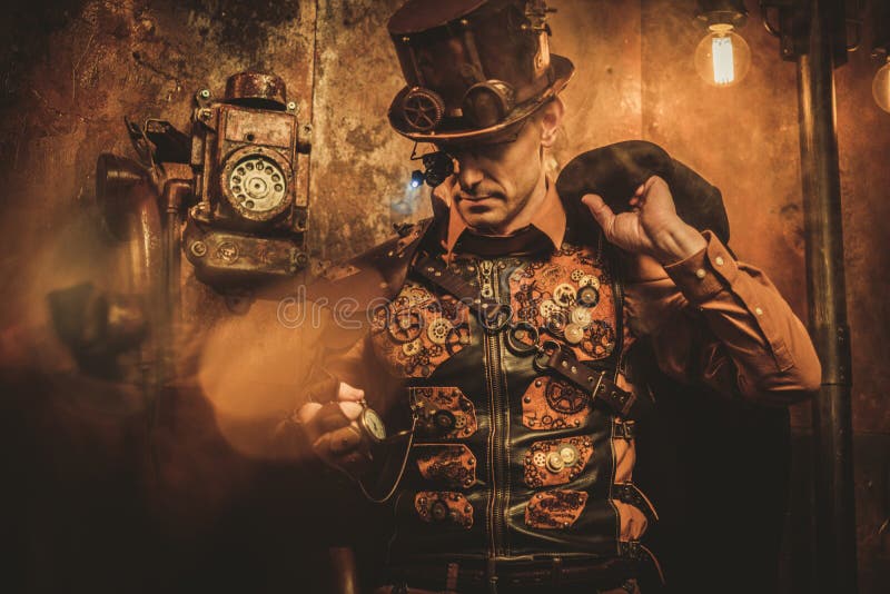 Steampunk style man with various mechanical devices on vintage steampunk background stock photos Steampunk style man with various mechanical devices on vintage steampunk background stock photos