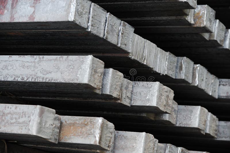 Steel billets in the warehouse of metallurgical factory. Hot ingot in a steel plant