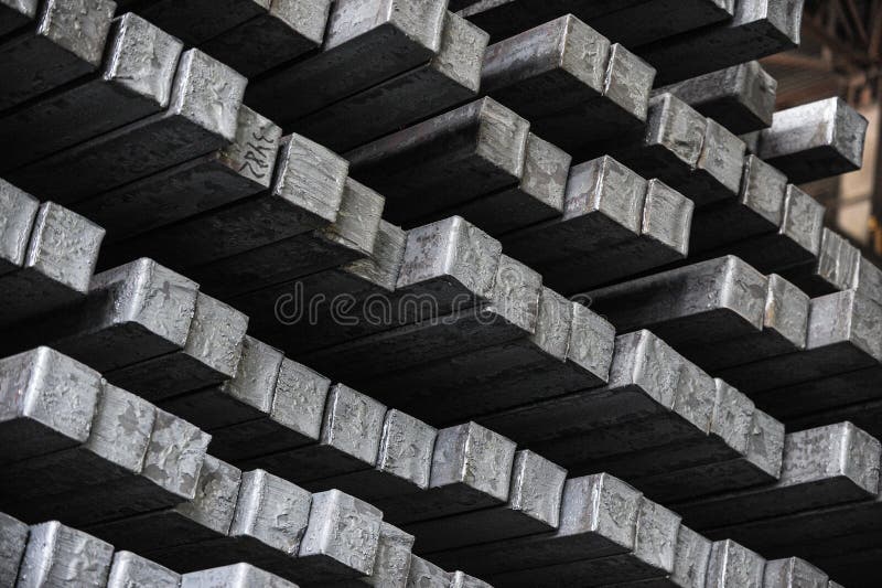 Steel billets in the warehouse of metallurgical factory. Hot ingot in a steel plant