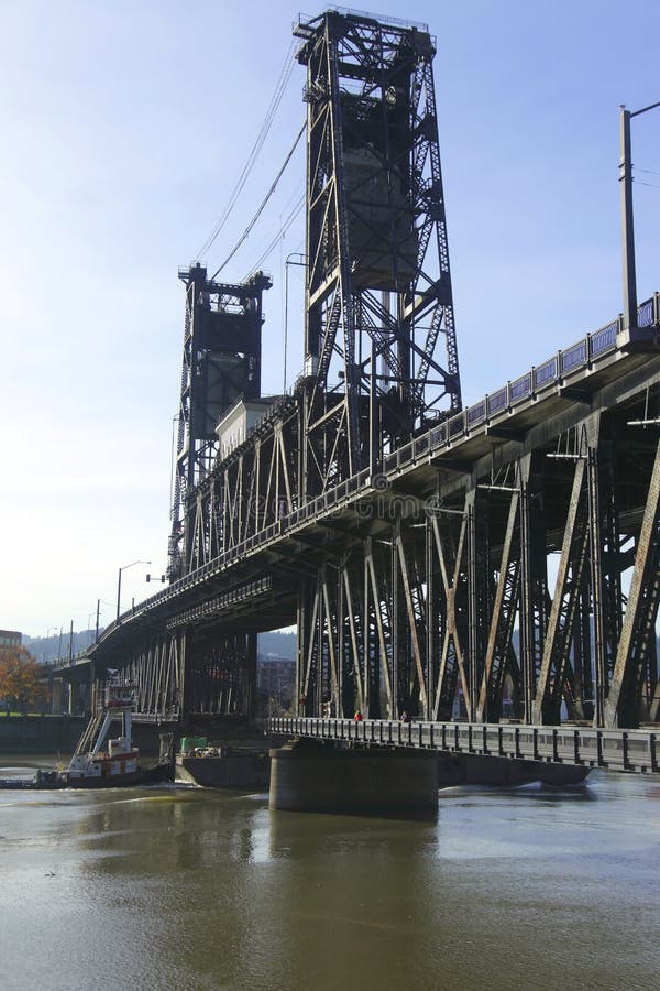 Steel bridge & a passing barge.
