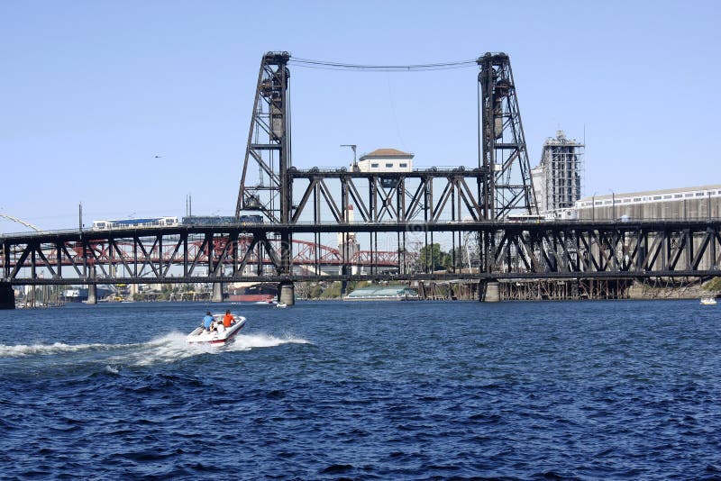 Steel bridge and a passing boat