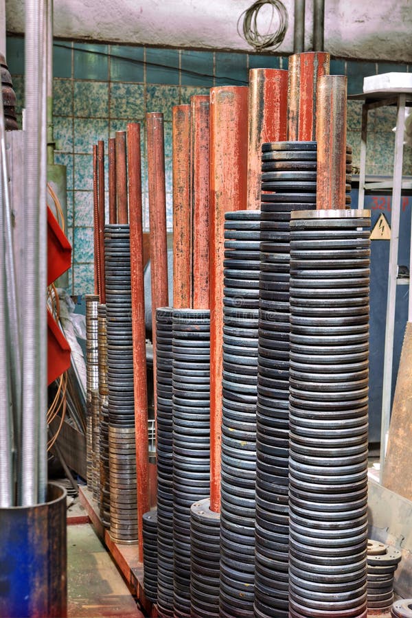 Steel discs on the spindle of a metal warehouse. royalty free stock image Steel discs on the spindle of a metal warehouse. royalty free stock image