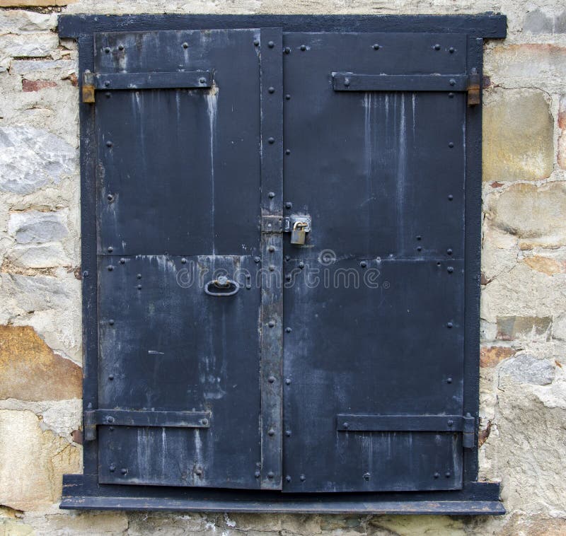 Steel Door on a Stone Building stock image