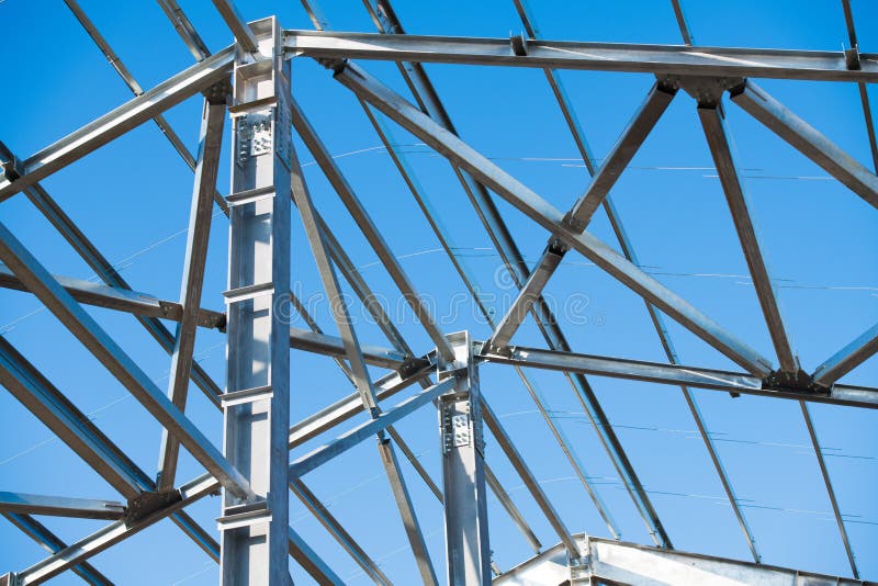 Steel Frame is Under Construction Against a Blue Sky Stock