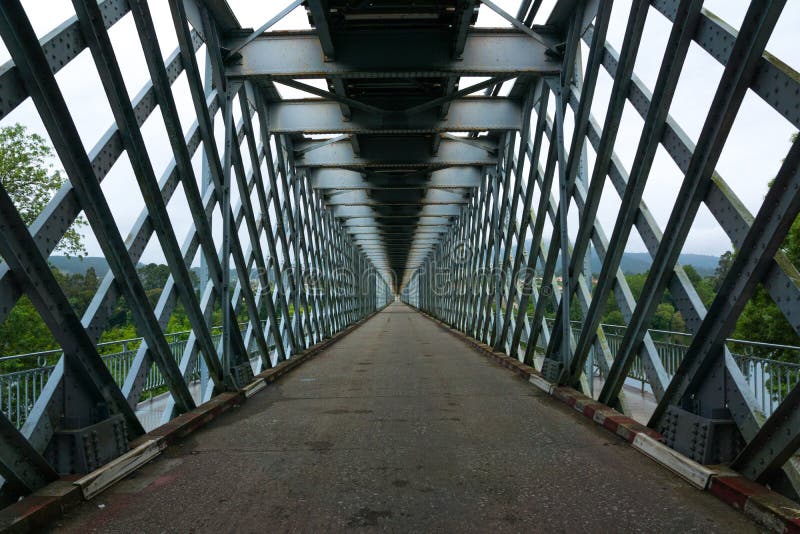Steel iron bridge with crossed lines. road perspective