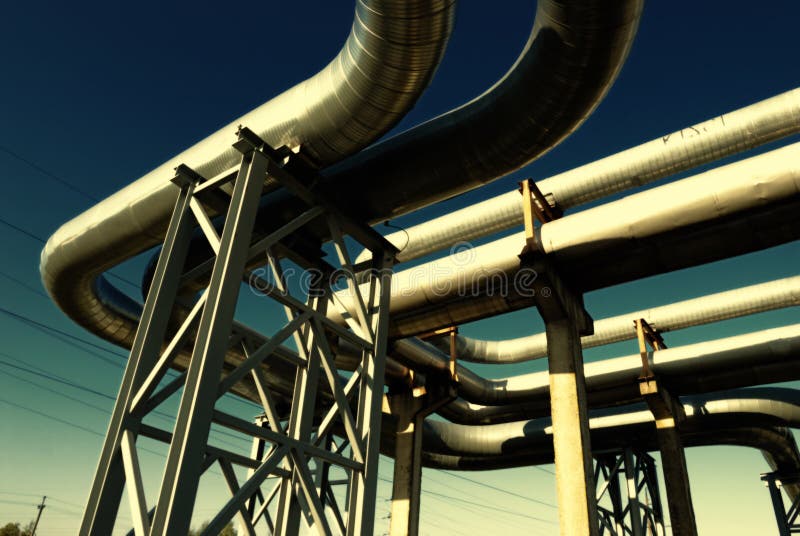 Steel pipe-line is photographed on sky background