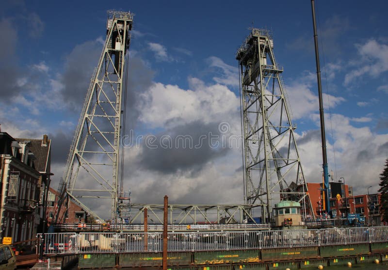 Steel vertical lift bridge in Boskoop over river Gouda during maintenance royalty free stock image Steel vertical lift bridge in Boskoop over river Gouda during maintenance royalty free stock image