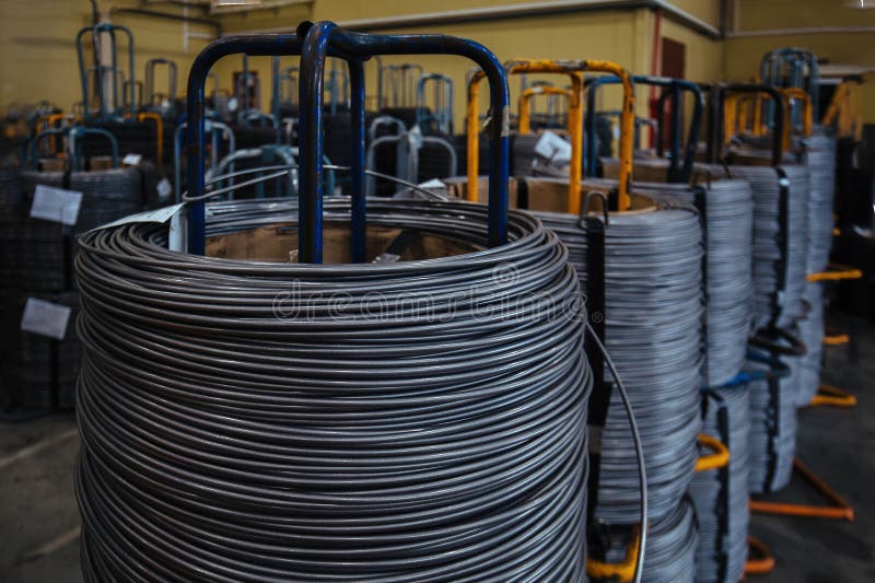 Steel wire coil in metalworking factory stock photo