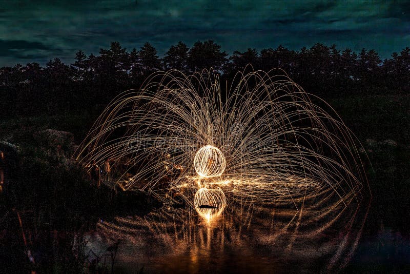 Steel Wool Painting and Reflection on the Lake. Stock Image Image of