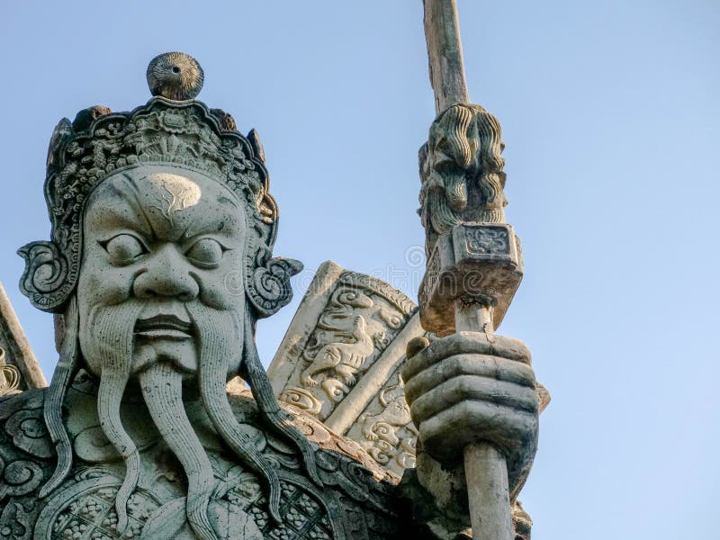 Steenstandbeeld in Wat Phra ChetuphonWat Pho van Thailand Chinese Reus stock afbeelding Steenstandbeeld in Wat Phra ChetuphonWat Pho van Thailand Chinese Reus stock afbeelding